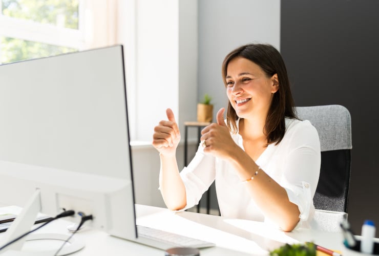 Woman smiling at portfolio results